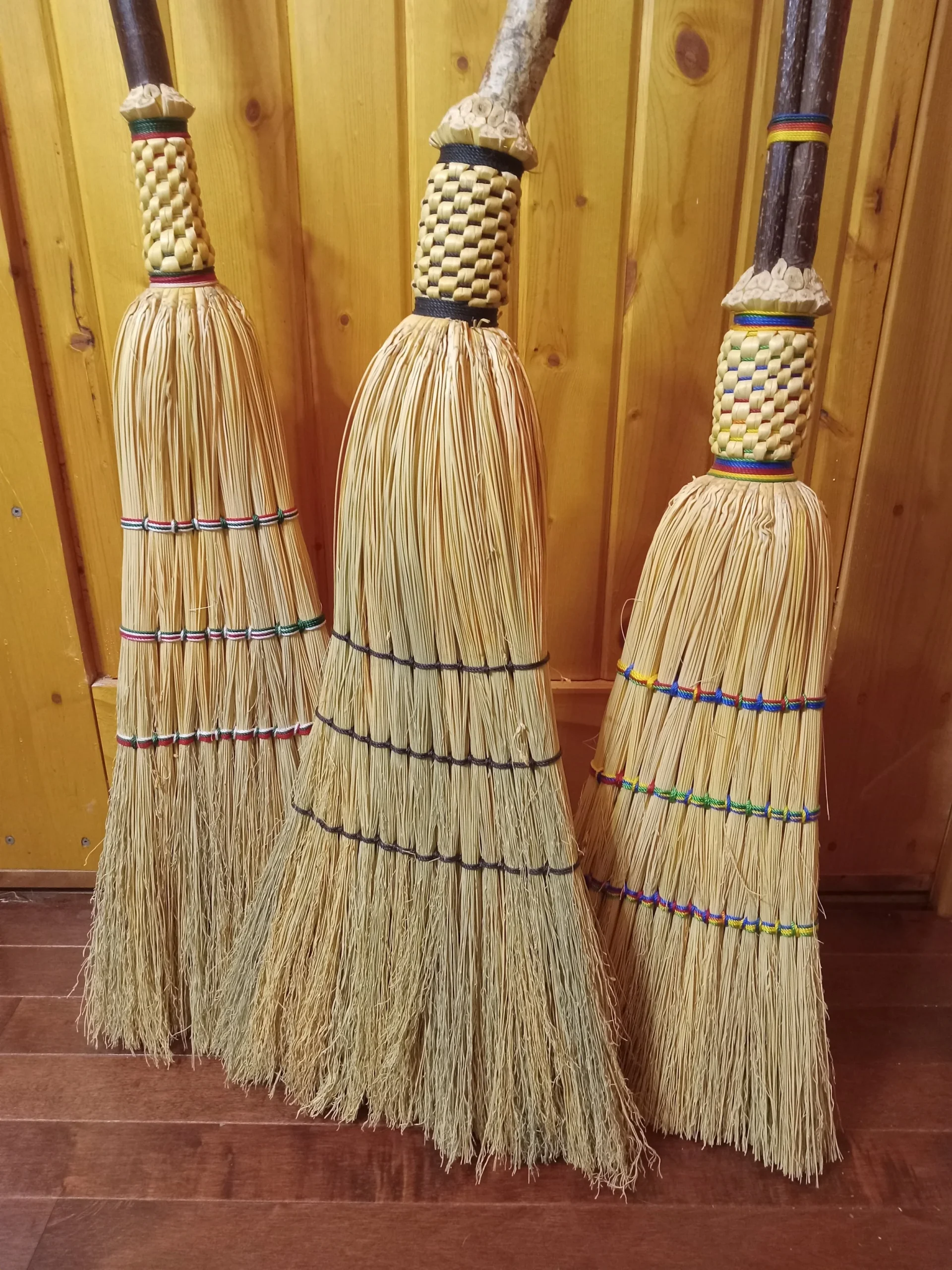 Handmade woven straw brooms