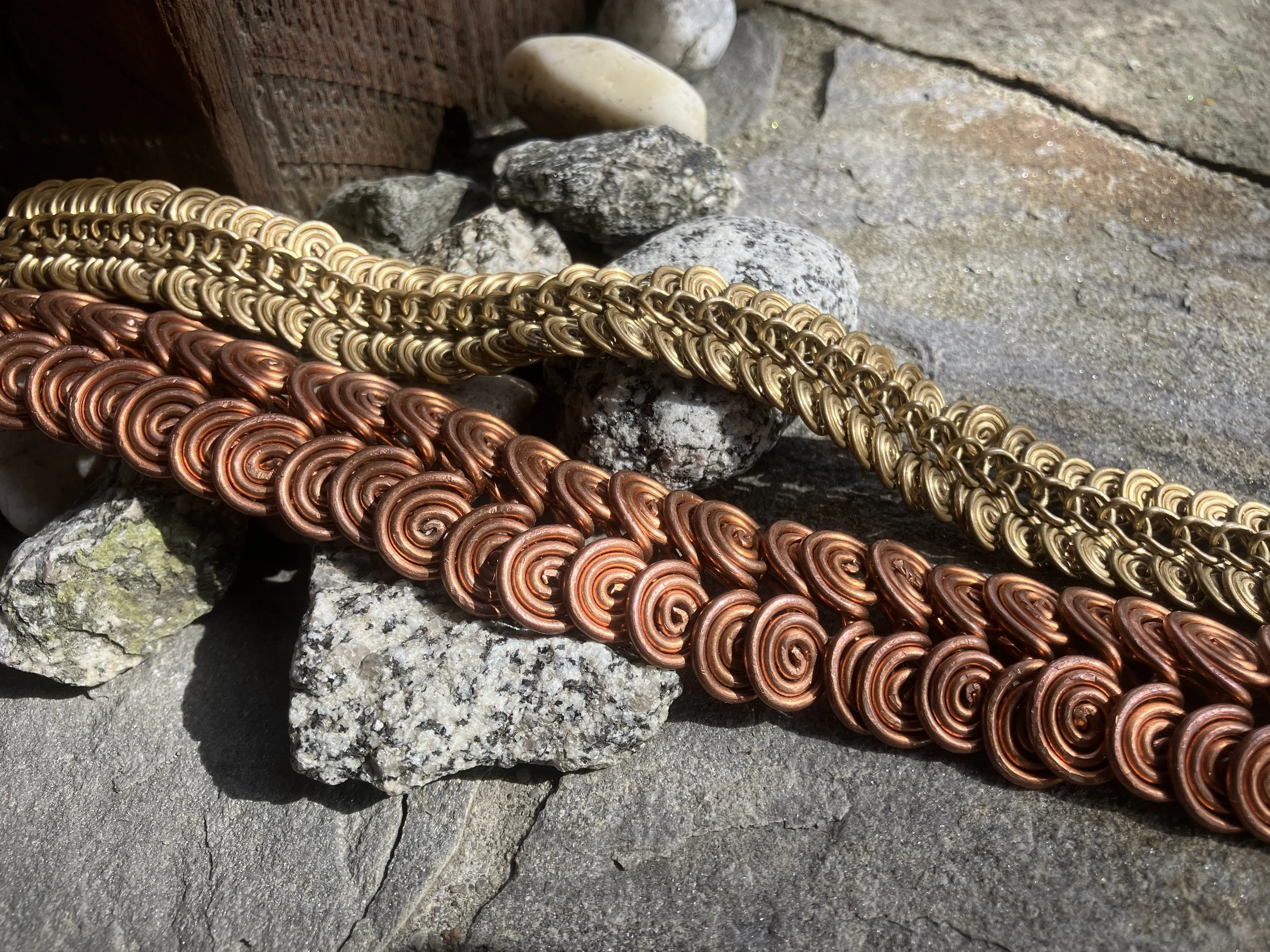 Copper and brass bracelets with spiral Egyptian links